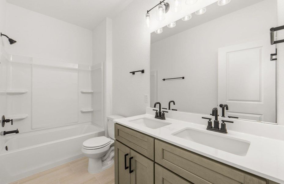 Furnished interior view inside a new home in Crosswinds, Kyle (Image 10).