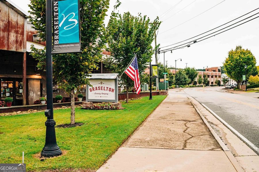 Front exterior of a new home in Rosewood Lake Estates, Hoschton, GA, highlighting curb appeal (Image 54).