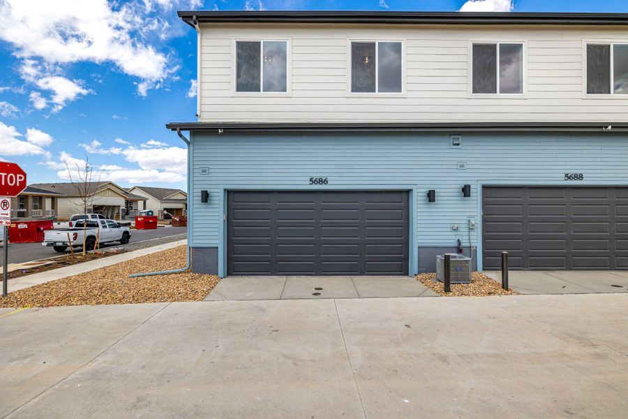 Front exterior of a new home in Painted Prairie, Aurora, CO, highlighting curb appeal (Image 25).