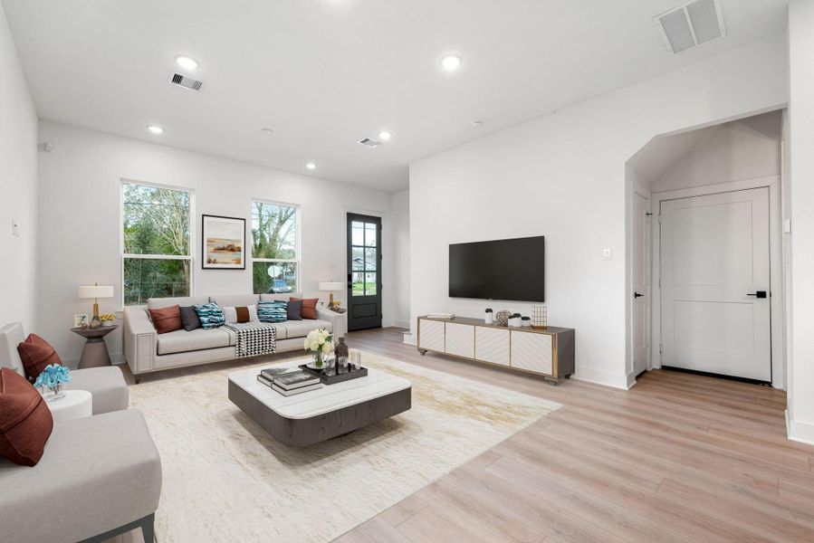 Light wood flooring adds warmth and sophistication, while the glass-paneled door invites guests and family to experience contemporary living at its finest in this beautifully crafted home! Light wood flooring adds warmth and sophistication, while the glass-paneled door invites guests and family to experience contemporary living at its finest in this beautifully crafted home!