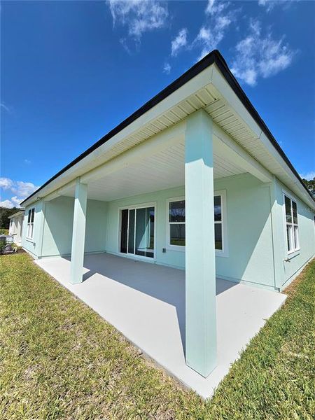 Exterior details and patio area of a home in Sawmill Branch Express, Palm Coast (Image 4).