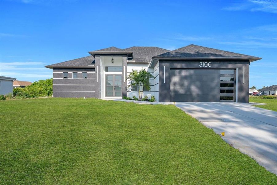 Front exterior of a new home in , Lehigh Acres, FL, highlighting curb appeal (Image 21).