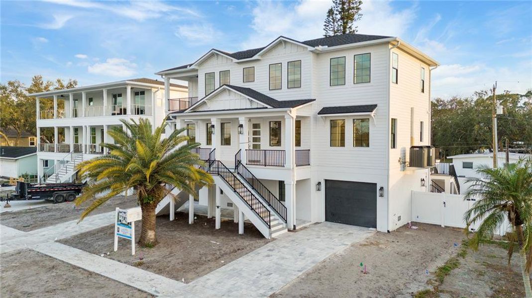 Front exterior of a new home in , St. Petersburg, FL, highlighting curb appeal (Image 17). Front exterior of a new home in , St. Petersburg, FL, highlighting curb appeal (Image 17).