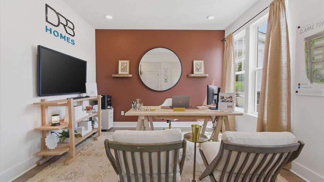Exclusive front of the home flex room with refined millwork and a peaceful, private setting at Clarke Townes