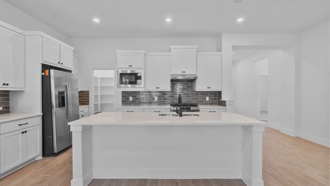 Furnished interior view inside a new home in Wildrye 45', Waller (Image 7).