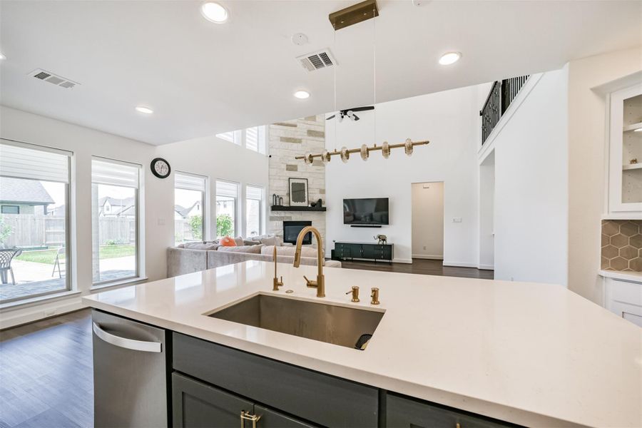 A built-in wine cooler. A clear view of the family room, seamlessly connected to the kitchen. A built-in wine cooler. A clear view of the family room, seamlessly connected to the kitchen.
