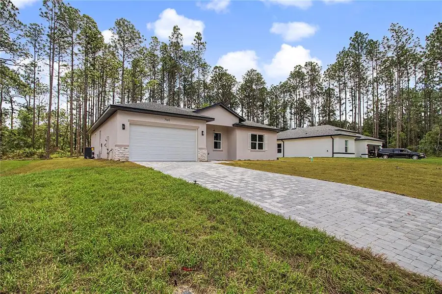 Front exterior of a new home in , Citrus Springs, FL, highlighting curb appeal (Image 2). Front exterior of a new home in , Citrus Springs, FL, highlighting curb appeal (Image 2).