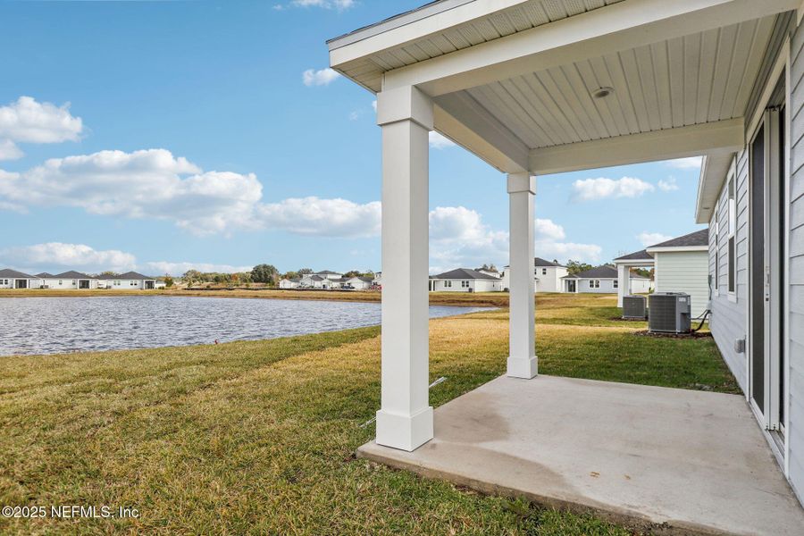 Front exterior of a new home in Lakes at Bella Lago - Signature Series, Green Cove Springs, FL, highlighting curb appeal (Image 2).