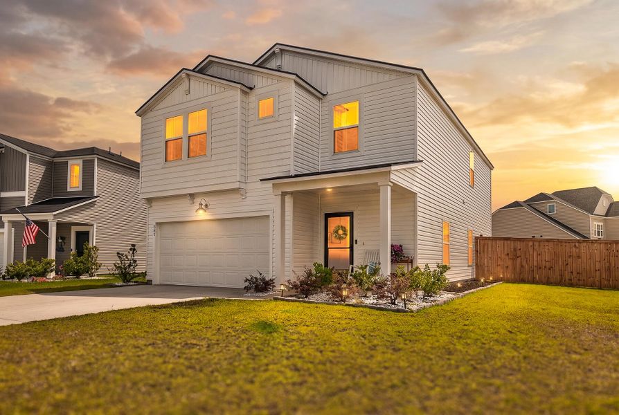 Front exterior of a new home in Lindera Preserve at Cane Bay Plantation, Summerville, SC, highlighting curb appeal (Image 24).