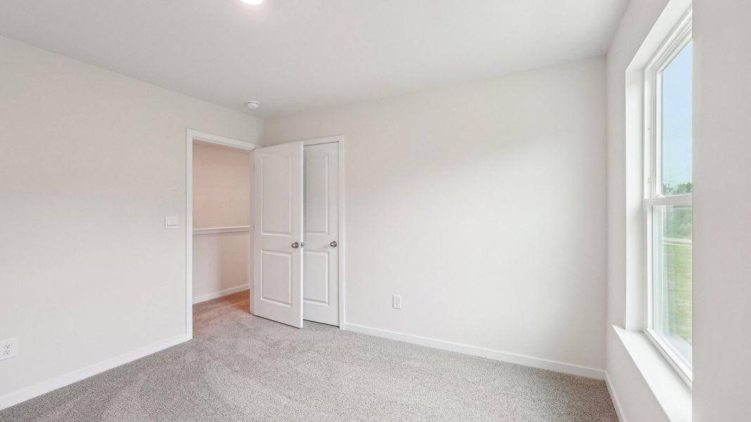 Spacious, unfurnished interior of a new home in Reedy Creek Preserve, Charlotte (Image 31).