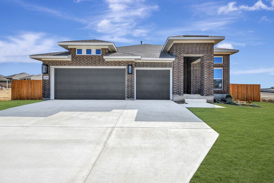 Front exterior of a new home in Meyer Ranch – Legacy Series, New Braunfels, TX, highlighting curb appeal (Image 1). Front exterior of a new home in Meyer Ranch – Legacy Series, New Braunfels, TX, highlighting curb appeal (Image 1).