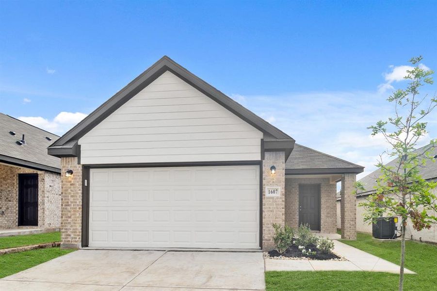 Front exterior of a new home in Christian Meadows, Ennis, TX, highlighting curb appeal (Image 2). Front exterior of a new home in Christian Meadows, Ennis, TX, highlighting curb appeal (Image 2).