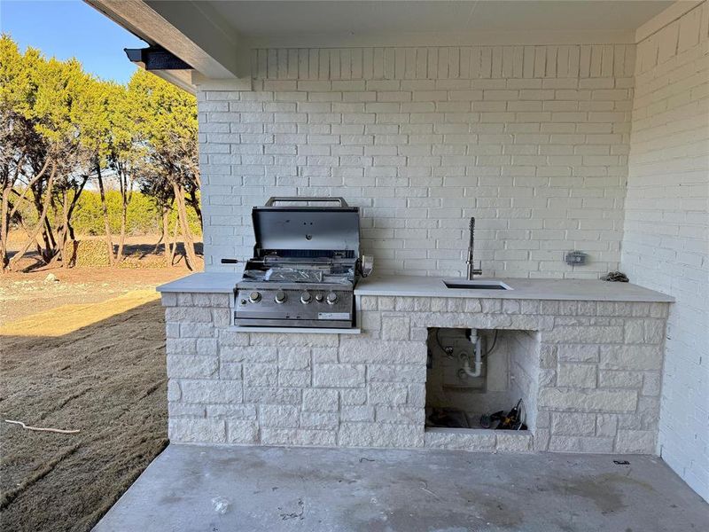 Covered patio with built in grill and sink