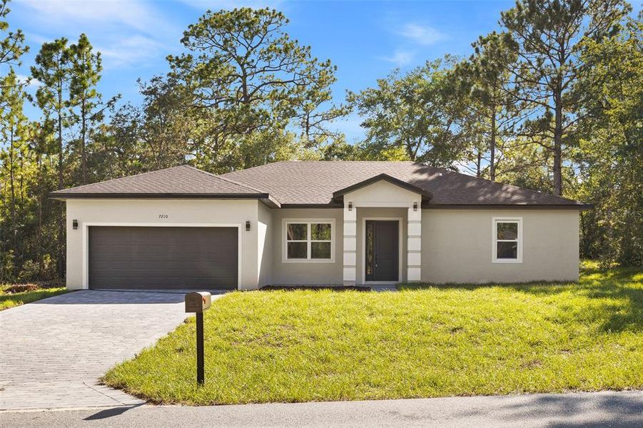 Front exterior of a new home in , Dunnellon, FL, highlighting curb appeal (Image 21). Front exterior of a new home in , Dunnellon, FL, highlighting curb appeal (Image 21).