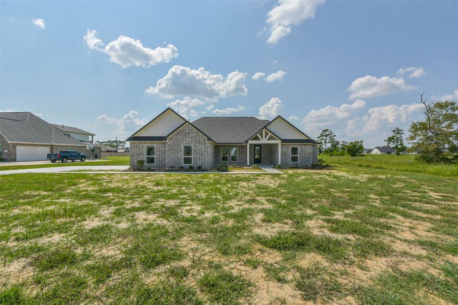 Front exterior of a new home in , Baytown, TX, highlighting curb appeal (Image 9). Front exterior of a new home in , Baytown, TX, highlighting curb appeal (Image 9).