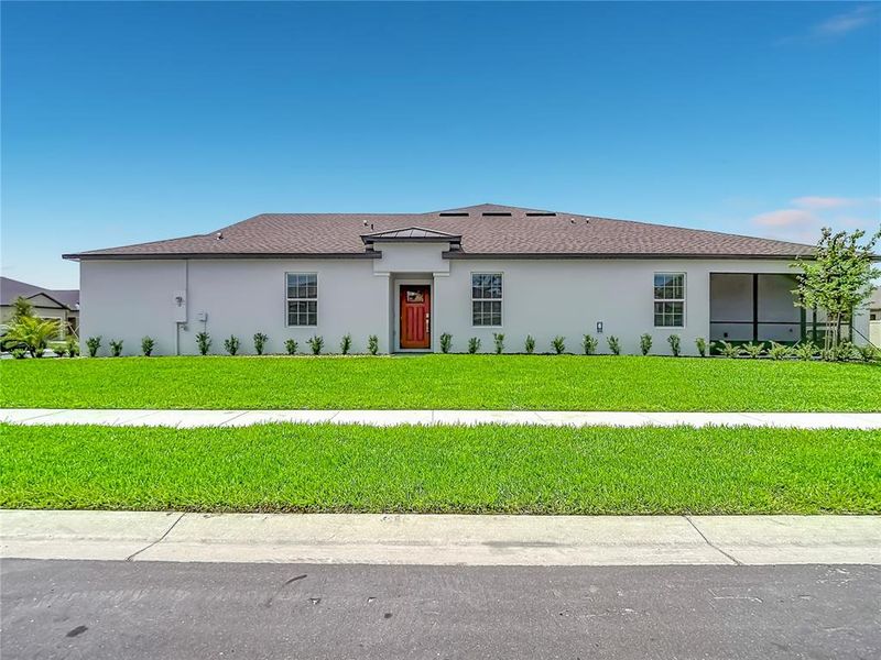Front exterior of a new home in New Port Corners Active Adult, New Port Richey, FL, highlighting curb appeal (Image 27). Front exterior of a new home in New Port Corners Active Adult, New Port Richey, FL, highlighting curb appeal (Image 27).
