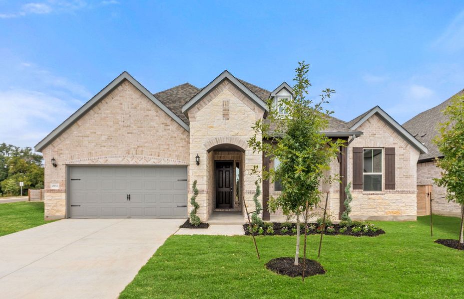 Front exterior of a new home in Bluffview Reserve, Leander, TX, highlighting curb appeal (Image 23).
