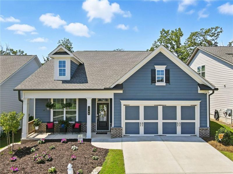Front exterior of a new home in Hickory Bluffs, Canton, GA, highlighting curb appeal (Image 1). Front exterior of a new home in Hickory Bluffs, Canton, GA, highlighting curb appeal (Image 1).