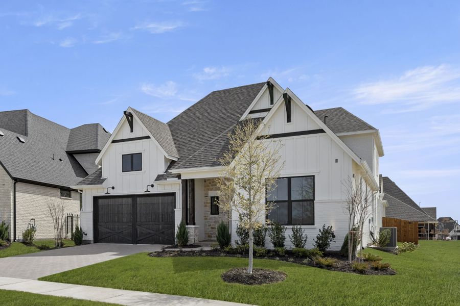 Front exterior of a new home in Mustang Lakes, Celina, TX, highlighting curb appeal (Image 28). Front exterior of a new home in Mustang Lakes, Celina, TX, highlighting curb appeal (Image 28).
