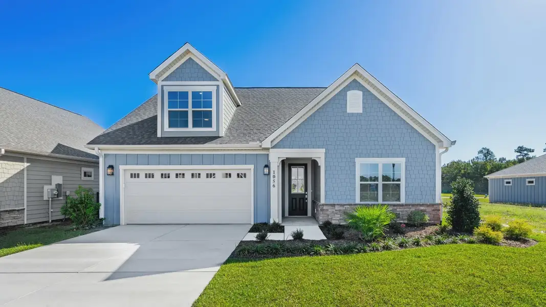 Representative exterior photo of a completed home built from the Capri IV by Epcon Communities in Courtyards by Carrell, Ocean Isle Beach, NC (Image 29). Representative exterior photo of a completed home built from the Capri IV by Epcon Communities in Courtyards by Carrell, Ocean Isle Beach, NC (Image 29).