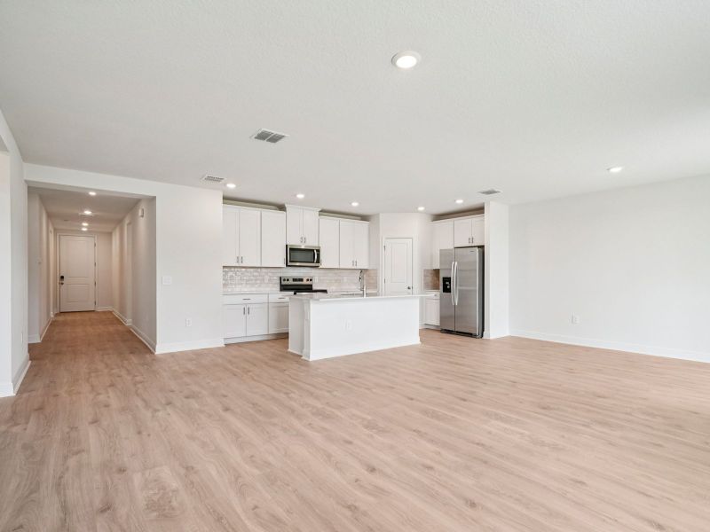 Spacious, unfurnished interior of a new home in The Reserve at Hammock Oaks - Signature Series, Lady Lake (Image 11).