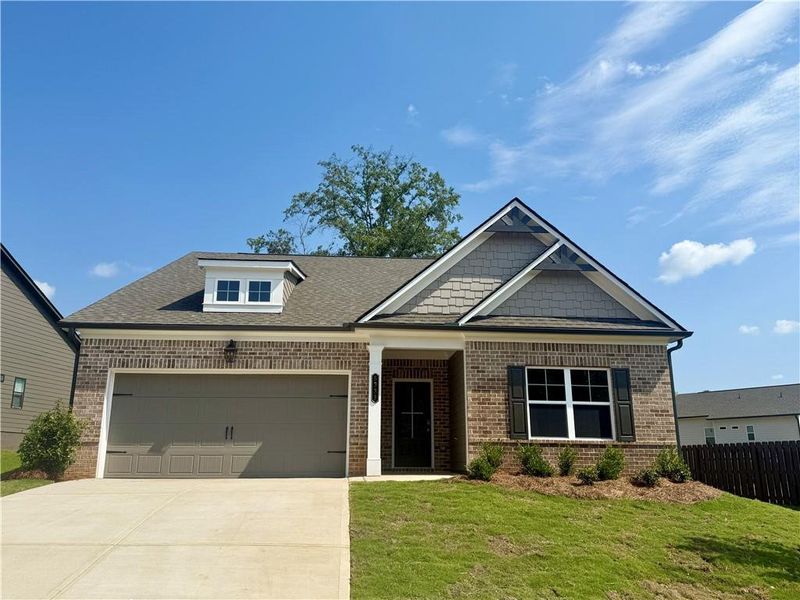 Front exterior of a new home in Ponderosa Farms Estates, Gainesville, GA, highlighting curb appeal (Image 1).
