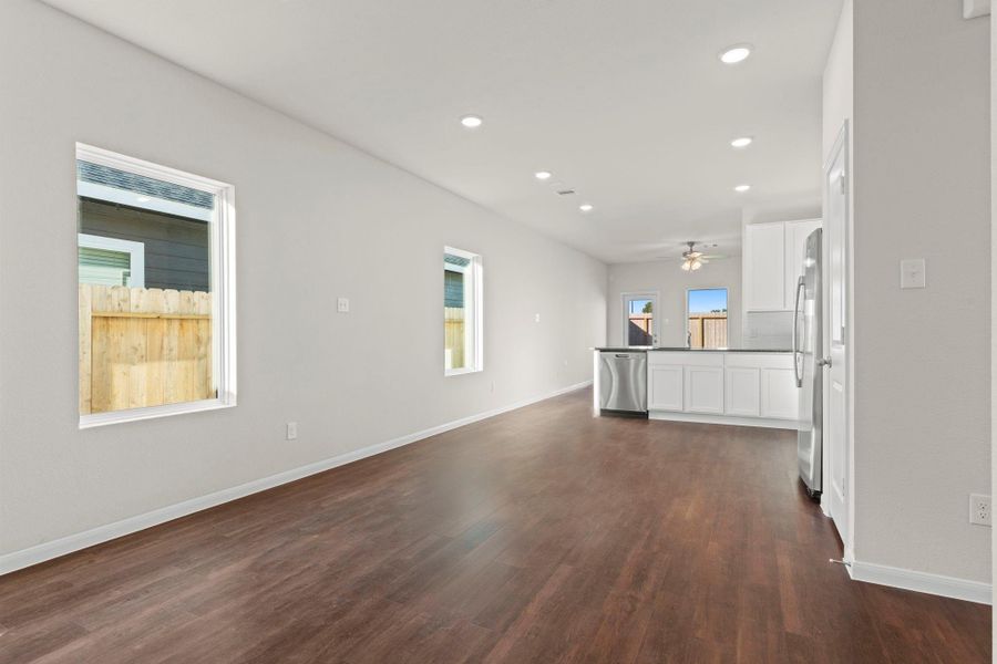 Bright and spacious dining area with wide windows that fill the home with natural light. This open layout connects beautifully to the kitchen, offering the perfect space for family gatherings and entertaining friends! Bright and spacious dining area with wide windows that fill the home with natural light. This open layout connects beautifully to the kitchen, offering the perfect space for family gatherings and entertaining friends!