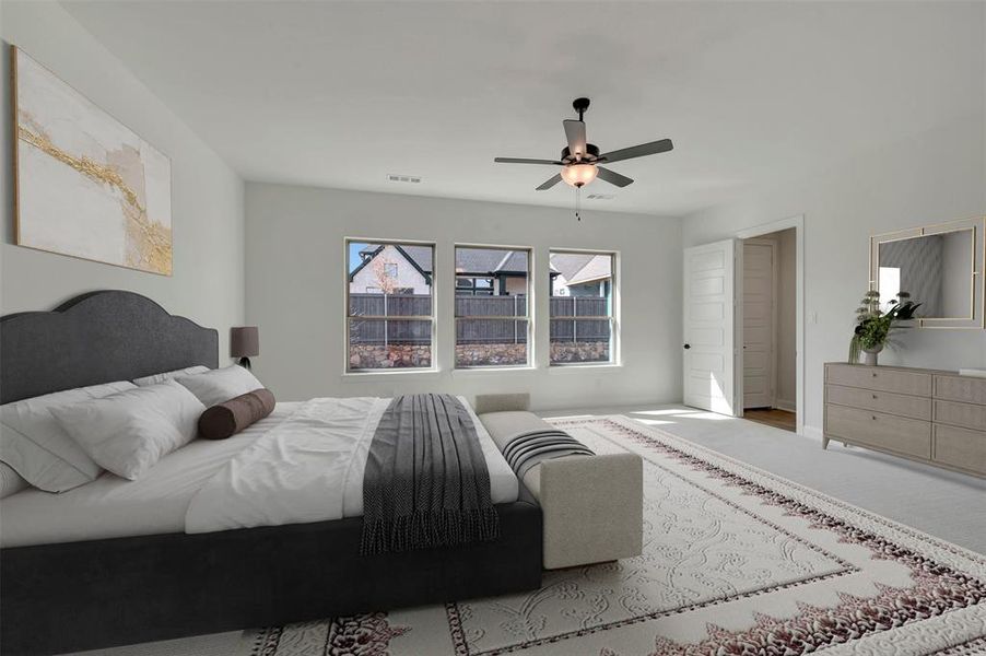 Bedroom with ceiling fan and carpet floors