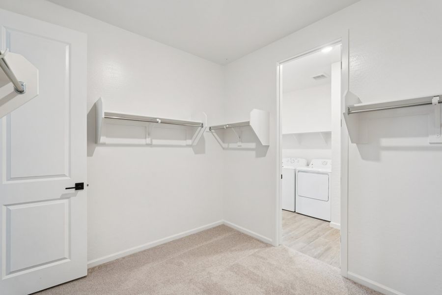 Primary walk in closet. Finishes and options may vary. Primary walk in closet. Finishes and options may vary.