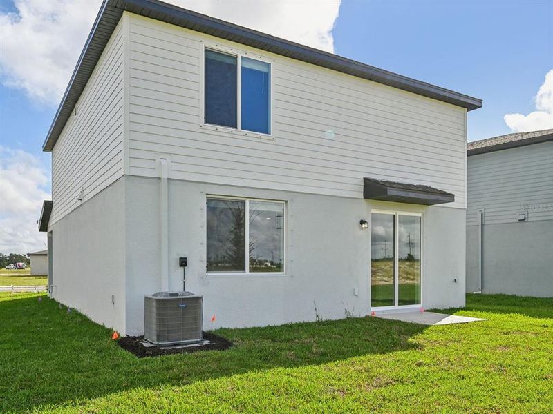 Exterior details and patio area of a home in Oakfield Trails - Signature Series, Parrish (Image 25).