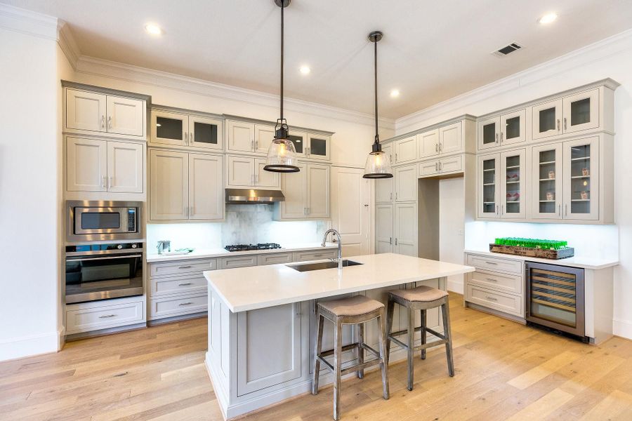 stacked cabinets in kitchen will look similar to this photo-soaring 12ft ceilinga