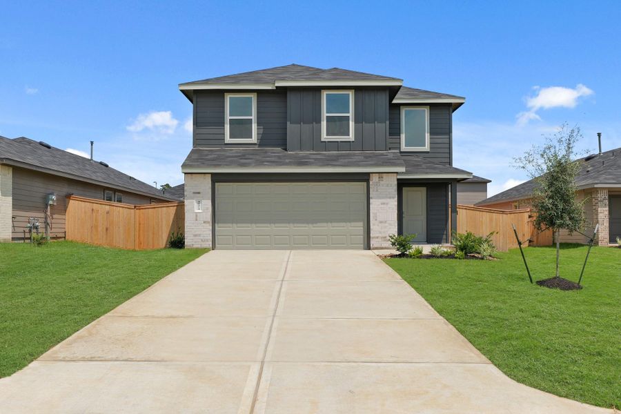 Front exterior of a new home in Mill Creek, Magnolia, TX, highlighting curb appeal (Image 2). Front exterior of a new home in Mill Creek, Magnolia, TX, highlighting curb appeal (Image 2).