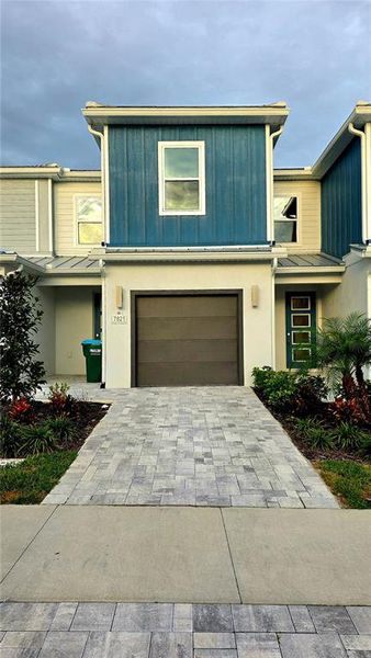 Front exterior of a new home in , Reunion, FL, highlighting curb appeal (Image 1).