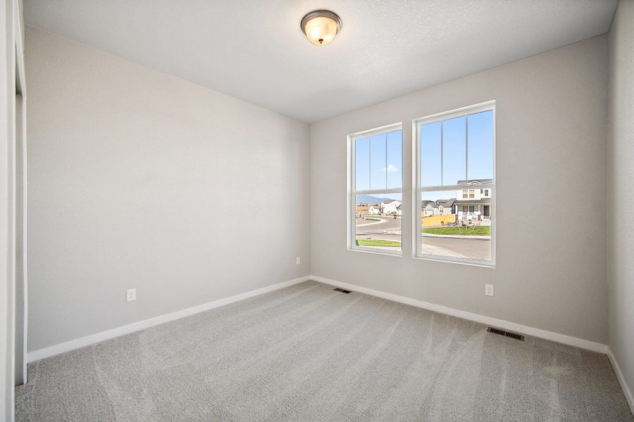 Spacious, unfurnished interior of a new home in The Glen, Colorado Springs (Image 13).