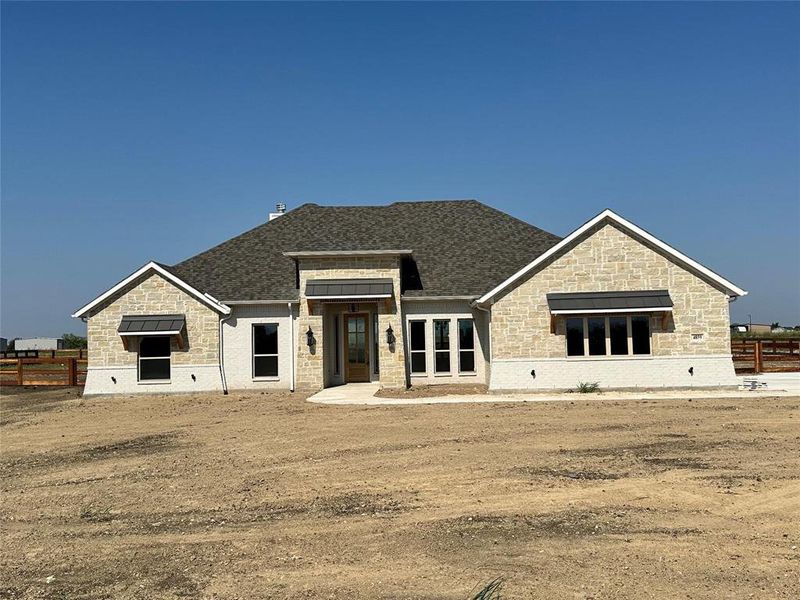 Front exterior of a new home in , Decatur, TX, highlighting curb appeal (Image 12). Front exterior of a new home in , Decatur, TX, highlighting curb appeal (Image 12).