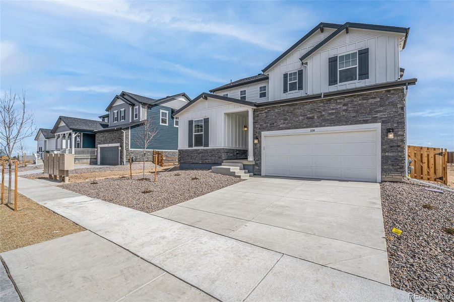 Front exterior of a new home in , Commerce City, CO, highlighting curb appeal (Image 1).