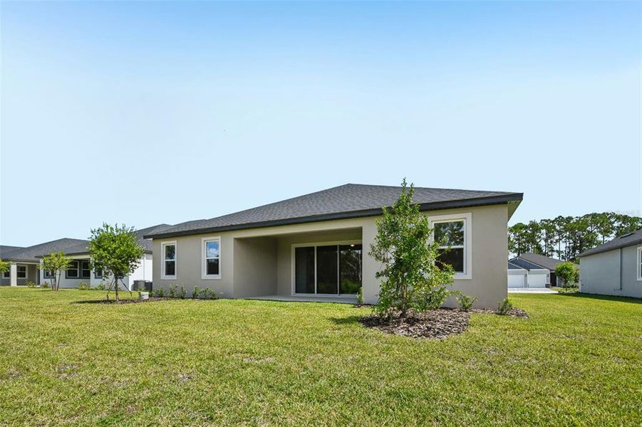 Exterior details and patio area of a home in Ridgehaven - Reserve Series, Ormond Beach (Image 24).