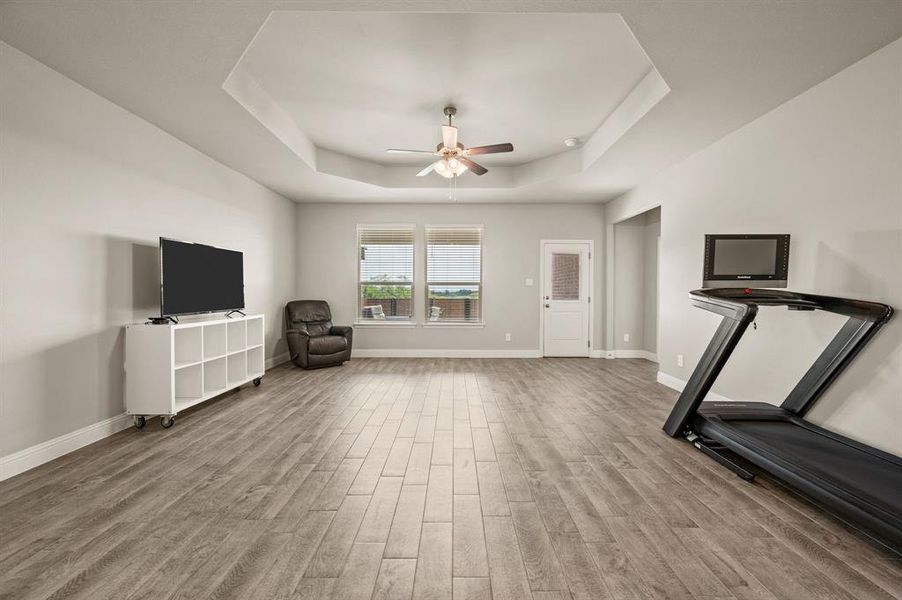 Oversized living room offering flexibility for multiple furniture arrangements, with easy access to the backyard.