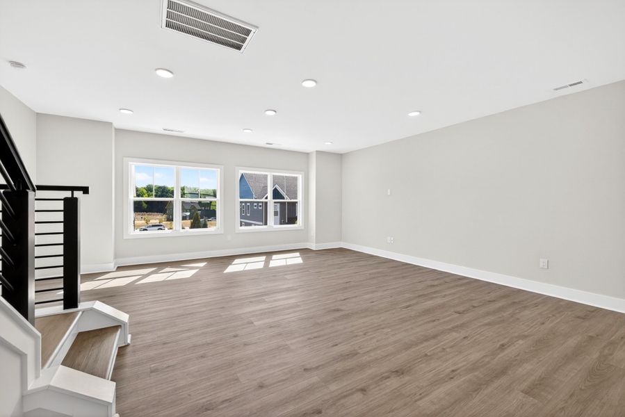 Representative unfurnished interior of a home built from the Atlas Interior Unit by Baker Residential in Atwater Station - Midtown Collection, Fuquay Varina (Image 28).