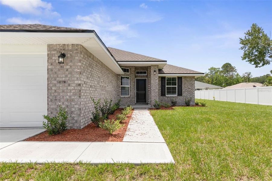 Exterior details and patio area of a home in Palm Coast, Palm Coast (Image 2).