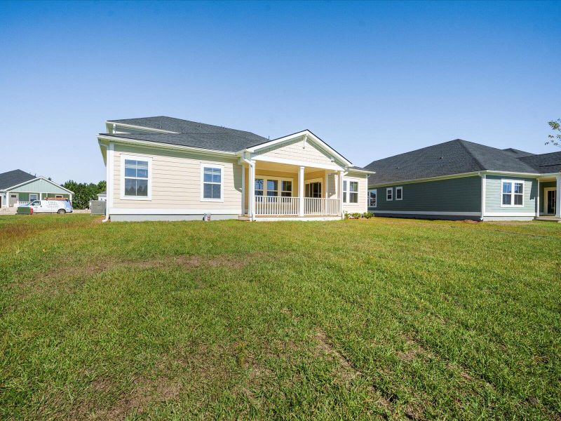 Exterior details and patio area of a home in The Coves at Lakes of Cane Bay II, Summerville (Image 3).