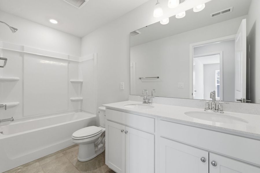 Furnished interior view inside a new home in Poets Walk, Whitsett (Image 9).