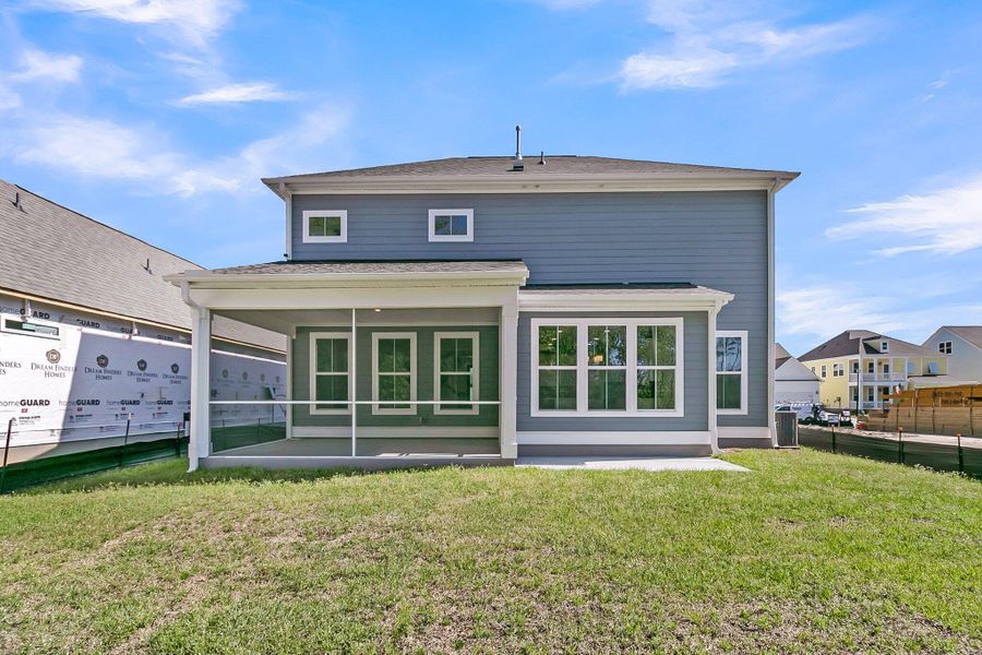 Front exterior of a new home in Tidewater at Lakes of Cane Bay, Summerville, SC, highlighting curb appeal (Image 2). Front exterior of a new home in Tidewater at Lakes of Cane Bay, Summerville, SC, highlighting curb appeal (Image 2).