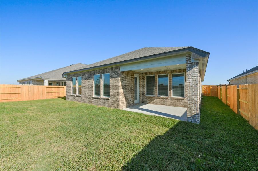 Front exterior of a new home in Lago Mar, La Marque, TX, highlighting curb appeal (Image 24).