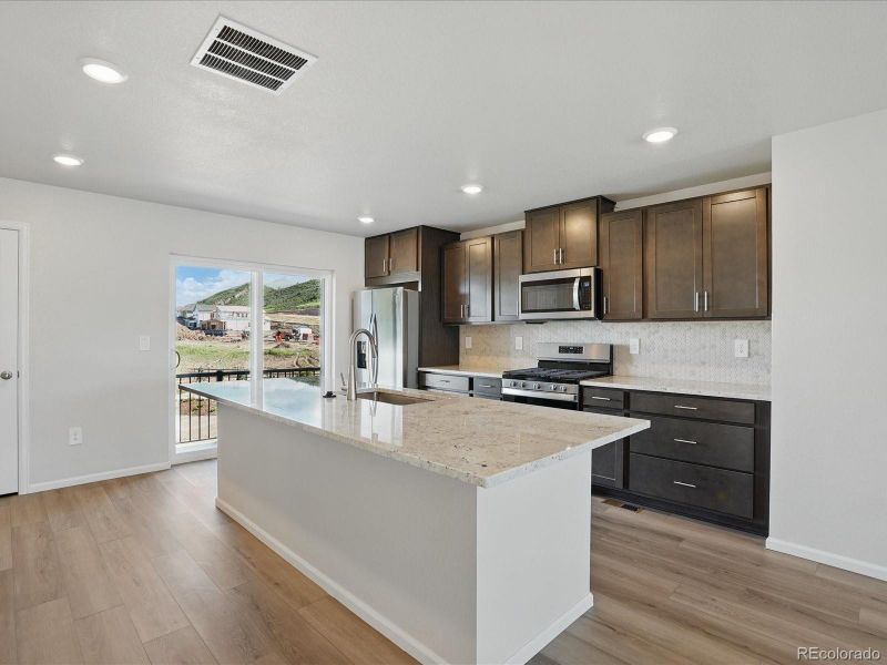 Furnished interior view inside a new home in Three Hills, Morrison (Image 9).