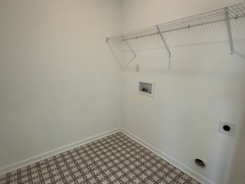 Laundry Room featuring the AW Collection® Coastal - Bright space with wire shelving for ease.