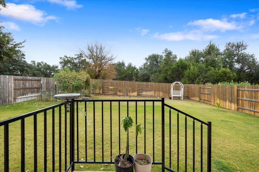 View of fenced backyard