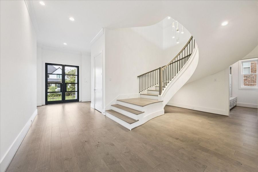 Sweeping staircase leads you to the second floor where you will find the Primary Suite and additional bedrooms, utility room and gameroom. Sweeping staircase leads you to the second floor where you will find the Primary Suite and additional bedrooms, utility room and gameroom.