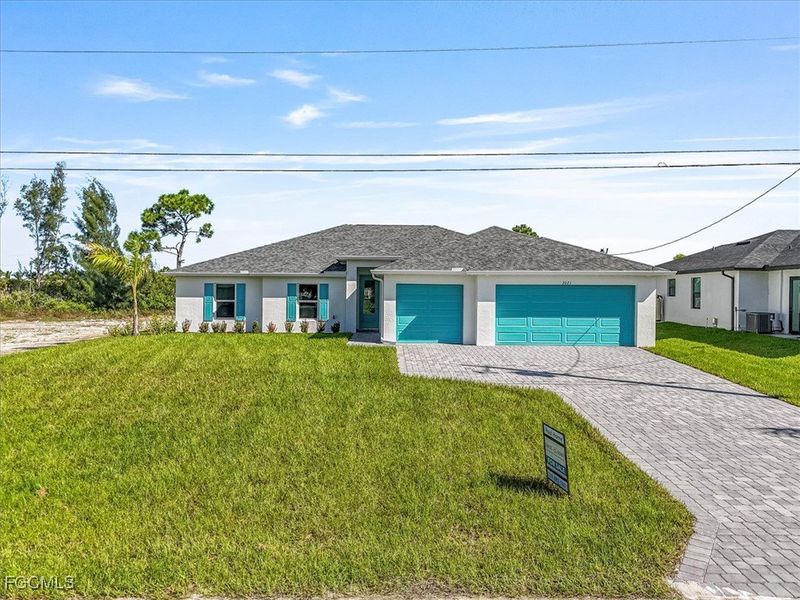 Front exterior of a new home in Cape Coral, Cape Coral, FL, highlighting curb appeal (Image 18).