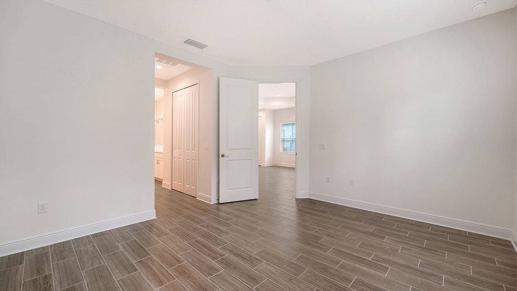 Spacious, unfurnished interior of a new home in Wildleaf Real Estate and Homes for Sale in Parrish, FL - Neal Communities, Parrish (Image 29). Spacious, unfurnished interior of a new home in Wildleaf Real Estate and Homes for Sale in Parrish, FL - Neal Communities, Parrish (Image 29).